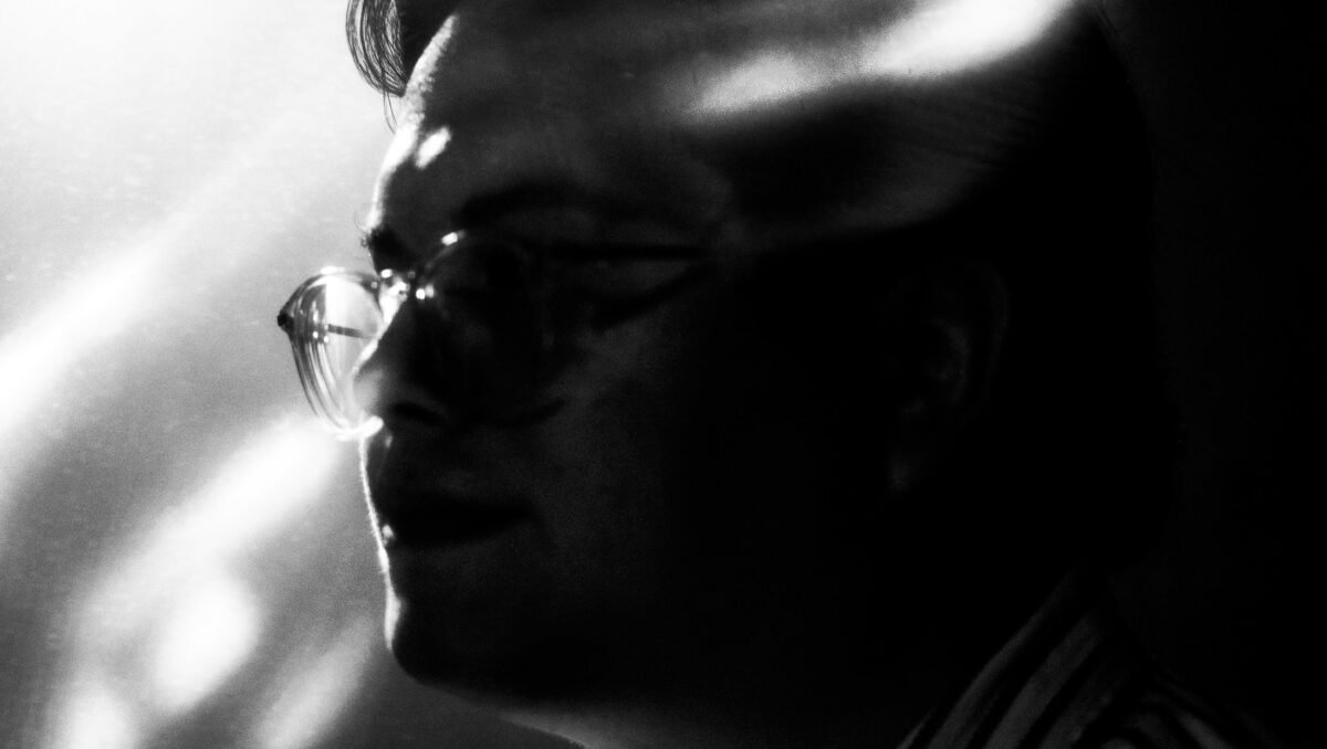 Black and white abstracted photo of a man in profile