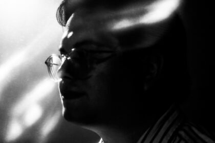 Black and white abstracted photo of a man in profile